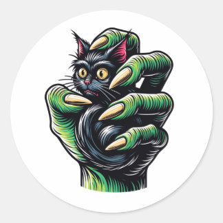 Pegatina Redonda Gato negro atrapado por la mano bruja