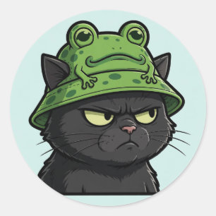 Pegatina Redonda Gato negro gruñón con sombrero de rana — Juzgándot