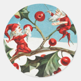 Pegatina Redonda Gnomes painting holly berries in the snow