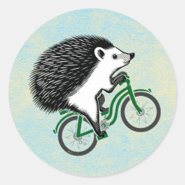 Pegatina Redonda Hedgehog montando una bicicleta sobre fondo azul