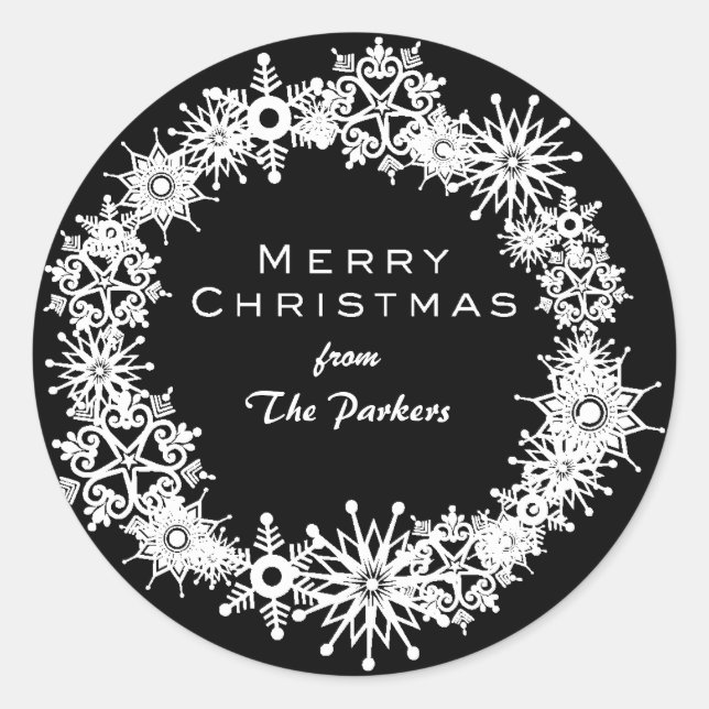 Pegatina Redonda Hermosos copos de nieve sobre fondo negro (Anverso)