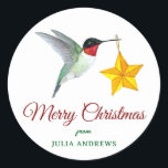 Pegatina Redonda Hummingbird personalizado Merry Christmas<br><div class="desc">Personalizado Merry Christmas pegatina con un colibrí gaviota con un adorno de estrellas. Solo agrega tu nombre. El estilo de letra y el tamaño de la fuente pueden cambiarse haciendo clic en "Editar usando la herramienta de diseño".</div>