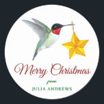 Pegatina Redonda Hummingbird personalizado Merry Christmas<br><div class="desc">Personalizado Merry Christmas pegatina con un colibrí gaviota con un adorno de estrellas. Solo agrega tu nombre. El estilo de letra y el tamaño de la fuente pueden cambiarse haciendo clic en "Editar usando la herramienta de diseño".</div>