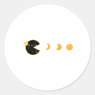 Pegatina Redonda Jugador de eclipse solar comiendo videojuego retro