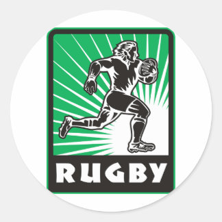 Pegatina Redonda jugador de rugby corriendo con bola