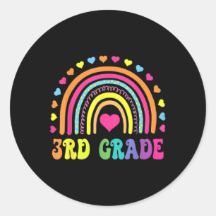 Pegatina Redonda Maestros de tercer grado en arcoiris de tercer gra
