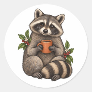 Pegatina Redonda Mapache Acogedor con Café y Hojas Botánicas