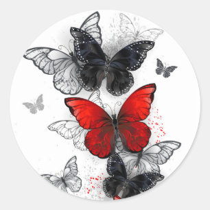 Pegatina Redonda Mariposas Morpho voladoras negras y rojas