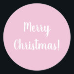 Pegatina Redonda Merry Christmas Pink Typography<br><div class="desc">Diseño de moda rosa Feliz Navidad. Este diseño tiene el mensaje festivo "¡Feliz Navidad!" En un texto moderno de tipografía blanca sobre un fondo rosa claro. Perfecto para sellos para sobres o para el toque final a sus regalos o bolsos de regalo esta temporada de vacaciones. Si desea cambiar el...</div>