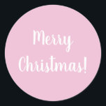 Pegatina Redonda Merry Christmas Pink Typography<br><div class="desc">Diseño de moda rosa Feliz Navidad. Este diseño tiene el mensaje festivo "¡Feliz Navidad!" En un texto moderno de tipografía blanca sobre un fondo rosa claro. Perfecto para sellos para sobres o para el toque final a sus regalos o bolsos de regalo esta temporada de vacaciones. Si desea cambiar el...</div>