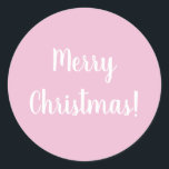 Pegatina Redonda Merry Christmas Pink Typography<br><div class="desc">Diseño de moda rosa Feliz Navidad. Este diseño tiene el mensaje festivo "¡Feliz Navidad!" En un texto moderno de tipografía blanca sobre un fondo rosa claro. Perfecto para sellos para sobres o para el toque final a sus regalos o bolsos de regalo esta temporada de vacaciones. Si desea cambiar el...</div>