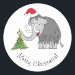 Pegatina Redonda Merry Christmas Tree Cute Mammoth Santa Hat<br><div class="desc">Este divertido Pegatina de la Ronda Clásica presenta al personalizado ilustracion del hermoso Mamut con un Sombrero de Santa y decorando el Árbol de Navidad. La suave nevada agrega más espíritu Navidad.</div>
