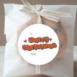 Pegatina Redonda Moderno estilo cómico Colorful Merry Christmas<br><div class="desc">Las modernas y coloridas etiquetas de regalo de los Pegatinas navideños de Feliz Feliz Navidad con texto cómico con corazones . Haga clic en el botón editar/personalizar para personalizar este diseño con el texto.</div>