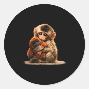 Pegatina Redonda Mono bebé abrazando peluche lindo macaco japonés