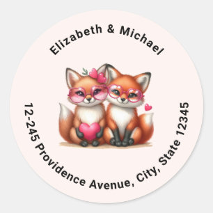 Pegatina Redonda Naranjas zorros adorables en la dirección de amor