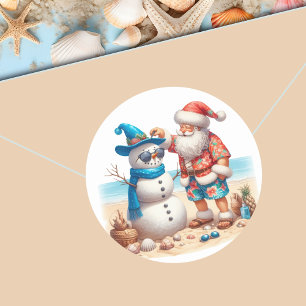 Pegatina Redonda Navidad en isla tropical con Santa y muñeco de nie