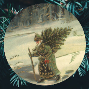 Pegatina Redonda Navidad Vintage, Santa Claus llevando un árbol