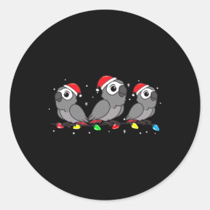 Pegatina Redonda Navidades de aves de loro gris iluminan a divertid