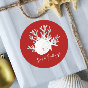 Pegatina Redonda Navidades de playa costera mar Rojo y saludos