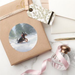 Pegatina Redonda Navidades Doberman Pinscher en invierno