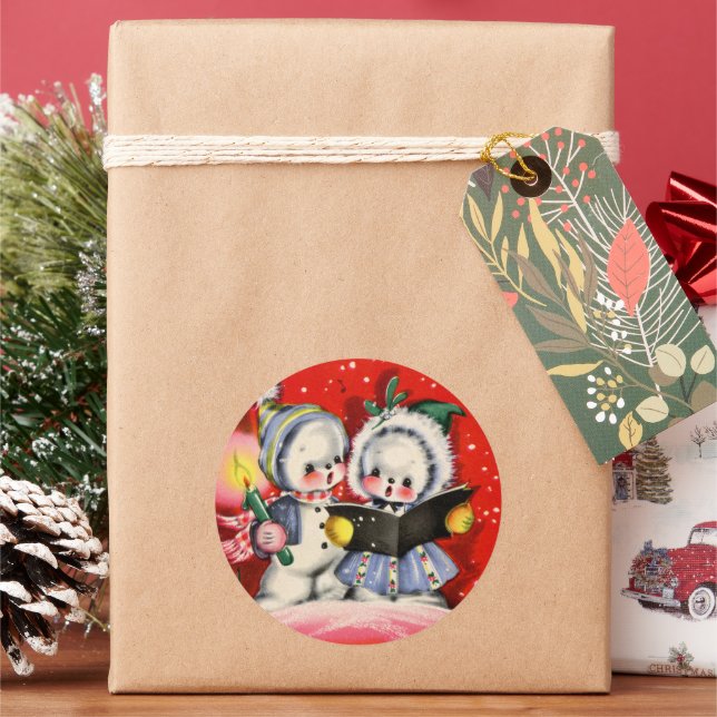 Pegatina Redonda navidades festivos acariciando a niños de nieve re (Vacaciones)