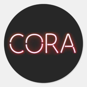 Pegatina Redonda Nombre de Cora en luces de neón brillantes