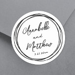 Pegatina Redonda Nombres Minimalistas simples Boda dibujado a mano<br><div class="desc">Sencillos stickers de boda Minimalista con marco de doodle negro. Estos encantadores stickers cuadrados de boda incluyen los nombres de la novia y del novio y la fecha de boda mostrada en una mezcla de fuentes limpias y elegantes. Alrededor del diseño hay un divertido marco de doodle negro dibujado a...</div>