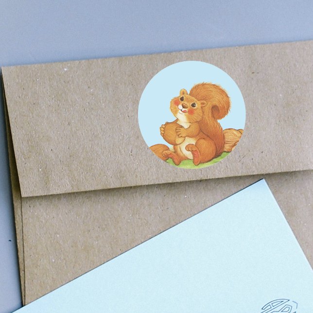 Pegatina Redonda Nueces de ardilla Adorables Cutas (Cute red squirrel rosy cheeks in grass with stash of nuts and acorns on stickers.)