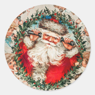 Pegatina Redonda Papá Noel en los teléfonos de cuerdas escuchando a