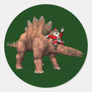 Pegatina Redonda Papá Noel montado en un estegosaurio