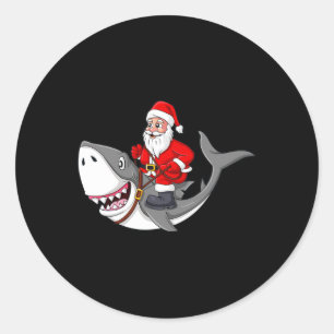 Pegatina Redonda Papá Noel viajando en Navidades de tiburones niños