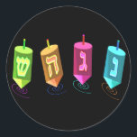 Pegatina Redonda Pegatinas de Four Dreidels<br><div class="desc">Cuatro sueños multicolores mostrando monja,  gimel,  hei y shin. Nes Gadol Hayah Sham. Un diseño de Chanukah.</div>