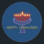 Pegatina Redonda Pegatinas felices de Chanukah<br><div class="desc">Conmemorar Chanukah con este impactante diseño gráfico de la menorah contra un fondo azul oscuro para enfatizar las velas encendidas. Este producto es personalizable, lo que le permite añadir palabras, imágenes y/o su logotipo. También puede cambiar el tamaño, la posición o incluso reemplazar la imagen de la plantilla con una...</div>