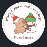 Pegatina Redonda Pegatinas navideñas divertidas - Capibara y Snowma<br><div class="desc">Chigüiro con snowman,  perfecto para ir con los regalos de tus Navidades.</div>