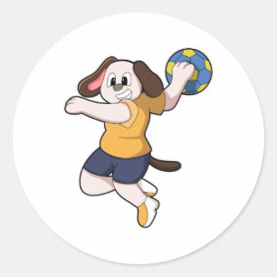 Pegatina Redonda Perro como jugador de balonmano con balonmano