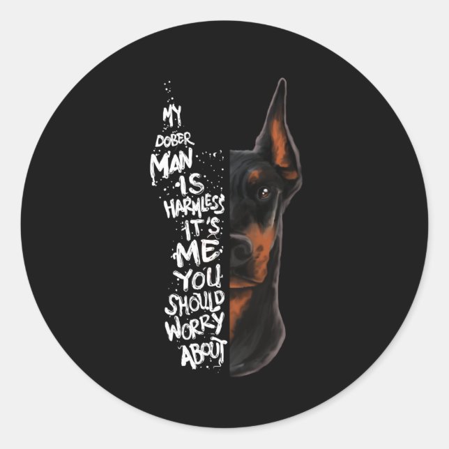 Pegatina Redonda Perro Doberman dice regalo inofensivo (Anverso)