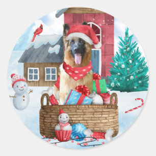 Pegatina Redonda Perro pastor alemán en casa de perro de Navidad en