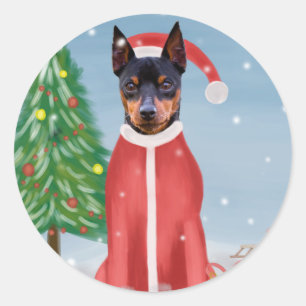 Pegatina Redonda Perro picante en miniatura en nieve con regalos de