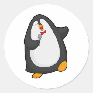 Pegatina Redonda Pingüino cantando con micrófono y corbata