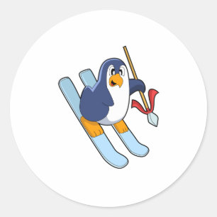 Pegatina Redonda Pingüino como esquiador con esquí