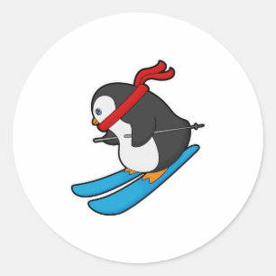 Pegatina Redonda Pingüino como esquiador con esquí