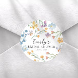 Pegatina Redonda Pretty Pastel Wildflower Bridal Shower<br><div class="desc">This elegant wildflower bridal shower sticker features a soft watercolor design with delicate blooms in pastel hues, creating a fresh and romantic look. Personalized with the bride’s name and event date, it’s perfect for sealing invitations, decorating favors, or adding a charming touch to bridal shower details. Ideal for garden, spring,...</div>