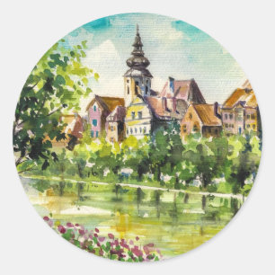 Pegatina Redonda Primavera en la pequeña ciudad del río
