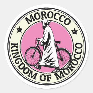 Pegatina Redonda Reino de Marruecos Jinete de bicicleta en la playa