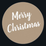 Pegatina Redonda Rustic Kraft Feliz Navidad en blanco<br><div class="desc">Un estilo rústico de papel kraft pegatina Feliz Navidad con escritura blanca para tu envoltura de regalo.</div>