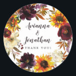 Pegatina Redonda Rústico Boda floral otoñal Gracias Por Favor<br><div class="desc">Las flores de caída dramáticas incluyen girasoles amarillos, peonías púrpuras, rosas rojas oscuras y hortensias blancas de marfil. Están enclavados en hojas de otoño y en viñas para crear una corona de bonito. Los nombres de las parejas de bodas se escriben en un tipo de letra de guión grande. Gracias,...</div>