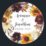 Pegatina Redonda Rústico Boda floral otoñal Gracias Por Favor<br><div class="desc">Las flores de caída dramáticas incluyen girasoles amarillos, peonías púrpuras, rosas rojas oscuras y hortensias blancas de marfil. Están enclavados en hojas de otoño y en viñas para crear una corona de bonito. Los nombres de las parejas de bodas se escriben en un tipo de letra de guión grande. Gracias,...</div>