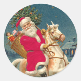 Pegatina Redonda Santa Claus on a wooden horse