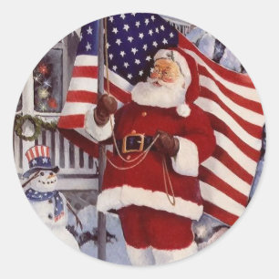 Pegatina Redonda Santa Claus sostiene la bandera estadounidense