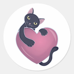 Pegatina Redonda Un gato negro lindo sujetándose al corazón grande
